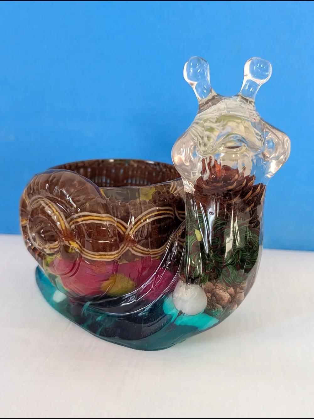 A unique vase in the form of a snail. Handmade.